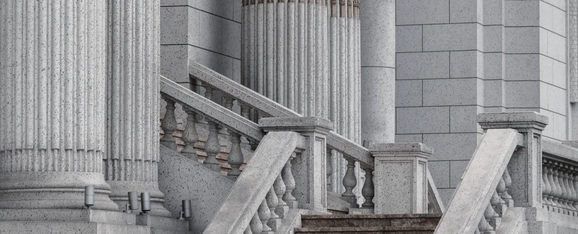 Stone steps rising between classical columns