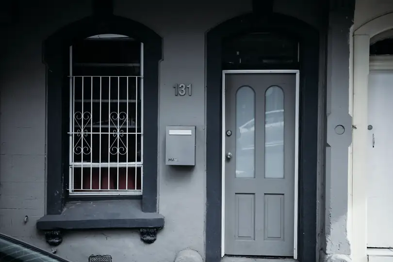 The front door and window of a terrace house