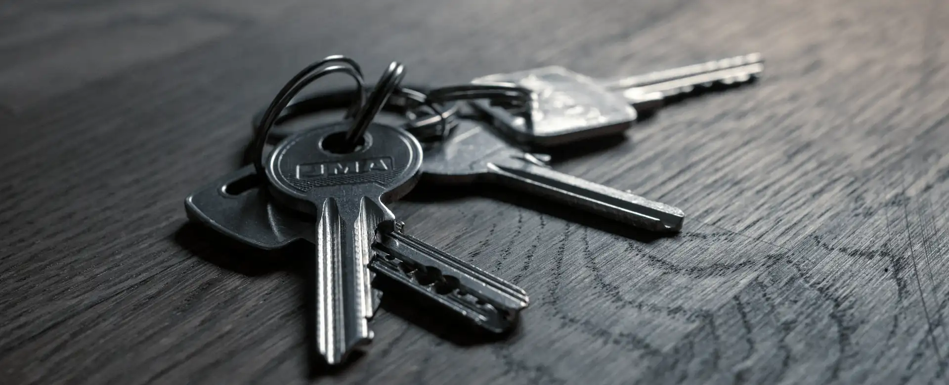 A set of keys on a timber table