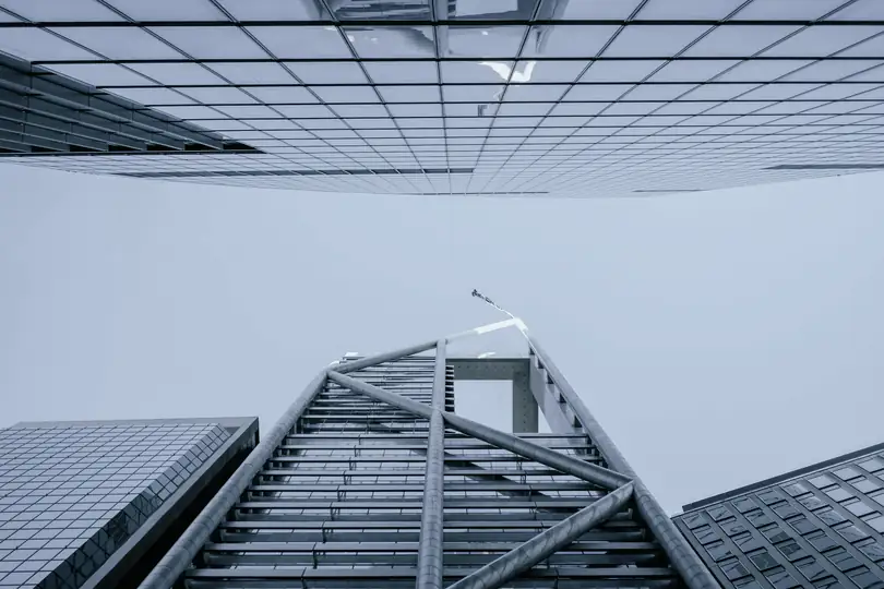 Office towers seen from the street, looking straight up