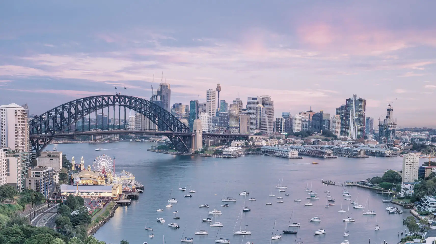 Sydney Harbour Bridge and the city skyline at dusk