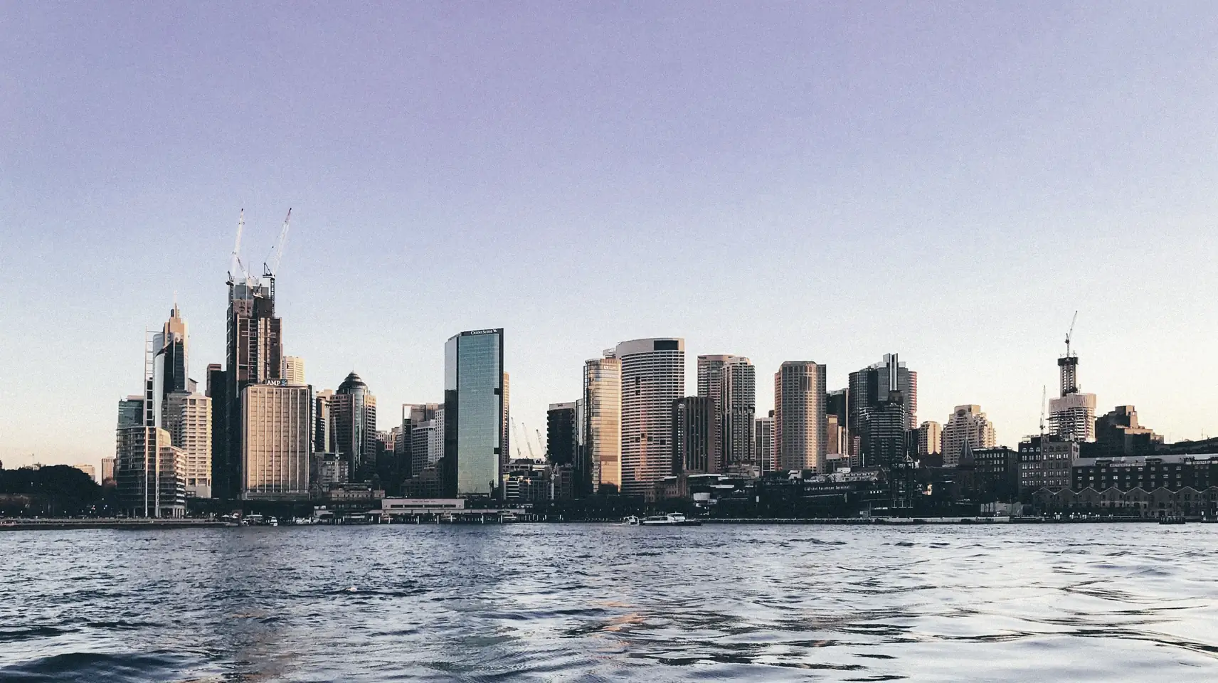 City skyline across the water at golden hour
